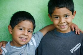 Panamanian elementary school boy with his arm around his slightly older friend – Best Places In The World To Retire – International Living